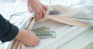 https://www.freepik.com/premium-photo/hand-taking-hidden-stash-cash-money-from-wardrobe-home_19161339.htm#fromView=search&page=1&position=19&uuid=a04e9a4d-5c5e-4f26-9da1-02defbd6c8b7&query=money+under+mattress