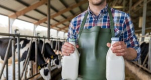 https://www.vecteezy.com/photo/54898192-dairy-worker-holding-milk-bottles-in-rustic-barn
