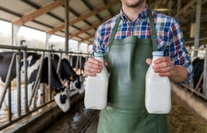 https://www.vecteezy.com/photo/54898192-dairy-worker-holding-milk-bottles-in-rustic-barn