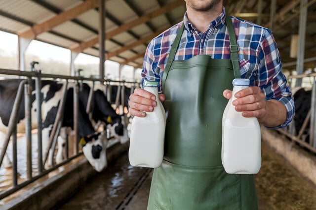 small-vecteezy_dairy-worker-holding-milk-bottles-in-rustic-barn_54898192_small https://www.vecteezy.com/photo/54898192-dairy-worker-holding-milk-bottles-in-rustic-barn
