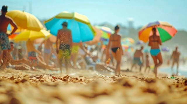 Defocused players tumbling in the sand with the vibrant umbrellas and beachgoers in the background adding to the chaotic scene https://www.vecteezy.com/photo/49727644-defocused-players-tumbling-in-the-sand-with-the-vibrant-umbrellas-and-beachgoers-in-the-background-adding-to-the-chaotic-scene