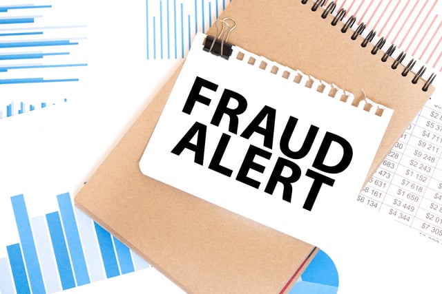 Text fraud alert on white paper sheet and brown paper notepad on the table with diagram. Business concept https://www.vecteezy.com/photo/32088192-text-fraud-alert-on-white-paper-sheet-and-brown-paper-notepad-on-the-table-with-diagram-business-concept