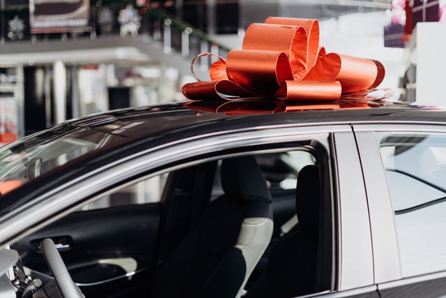 https://www.vecteezy.com/photo/3114948-the-new-car-is-wrapped-in-a-red-bow-beautiful-gift-concept
