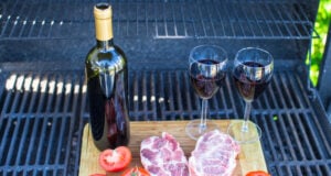 https://www.vecteezy.com/photo/18124300-two-glass-of-red-wine-steak-and-tomatoes-on-barbecue-outdoors