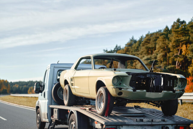 https://www.freepik.com/premium-photo/emergency-towing-service-action-highway-yellow-tow-truck-transports-damaged-car-flatbed-carrier-rear-view-vehicles-shows-brake-lights-motion-traffic_266312884.htm#fromView=search&page=1&position=10&uuid=a60ba5e0-d192-47a4-b74e-f92857f704f7&query=car+towed