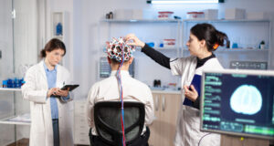 https://www.freepik.com/free-photo/back-view-man-patient-wearing-performant-brainwave-scanning-headset-sitting-neurological-research-laboratory-while-medical-researcher-adjusting-it-examining-nervous-system-typing-tablet_18471164.htm#fromView=image_search&page=1&position=19&uuid=c9e398de-48d5-41fe-be6e-108e359882fd&query=brain+EEG