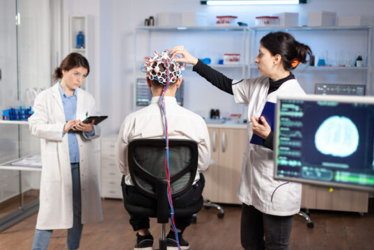 https://www.freepik.com/free-photo/back-view-man-patient-wearing-performant-brainwave-scanning-headset-sitting-neurological-research-laboratory-while-medical-researcher-adjusting-it-examining-nervous-system-typing-tablet_18471164.htm#fromView=image_search&page=1&position=19&uuid=c9e398de-48d5-41fe-be6e-108e359882fd&query=brain+EEG