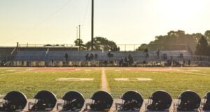 https://unsplash.com/photos/a-group-of-football-helmets-sitting-on-top-of-a-field-civXaE08gKE