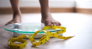 https://www.vecteezy.com/photo/19050447-a-woman-on-a-scale-the-yellow-tape-is-in-focus-weight-loss-diet-concept