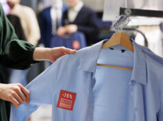 https://www.vecteezy.com/photo/47366526-close-up-of-unrecognizable-woman-shopper-looking-at-clothes-with-red-discount-tag-while-shopping-in-outlet-store-during-black-friday-female-customer-holding-shirt-making-purchases-in-sale-season
