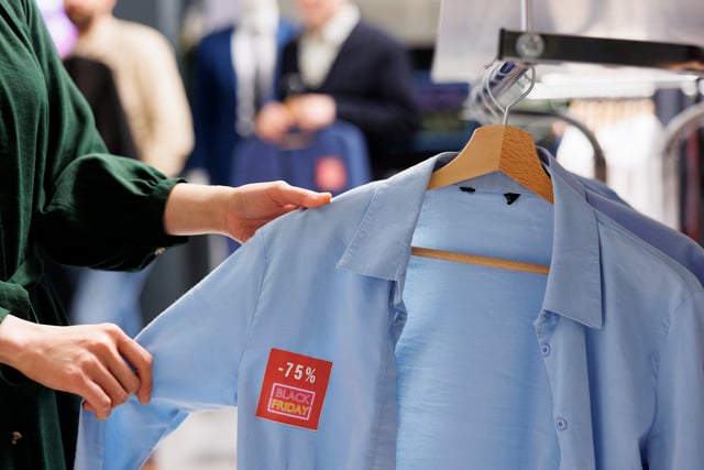 https://www.vecteezy.com/photo/47366526-close-up-of-unrecognizable-woman-shopper-looking-at-clothes-with-red-discount-tag-while-shopping-in-outlet-store-during-black-friday-female-customer-holding-shirt-making-purchases-in-sale-season