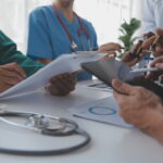 Medical technology network team meeting concept. Doctor hand wor