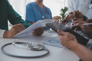 https://www.vecteezy.com/photo/26571483-medical-technology-network-team-meeting-concept-doctor-hand-working-smart-phone-modern-digital-tablet-laptop-computer-graphics-chart-interface-sun-beams-effect-photo