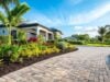 https://www.vecteezy.com/photo/49858329-this-stunning-modern-miami-home-showcases-an-elegant-brick-driveway-beautifully-lush-landscaping-tall-majestic-palm-trees-and-a-large-garage-door-that-significantly-boosts-its-overall-curb-appeal