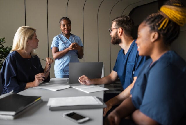 2149741277 https://www.freepik.com/free-photo/side-view-healthcare-professionals-meeting_32486210.htm#fromView=search&page=1&position=3&uuid=a37cbf4c-41ae-49fa-a0ee-7d5de906a8c4&query=nurse+leader