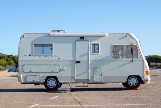 https://www.pexels.com/photo/white-camper-van-parked-on-the-road-12441114/