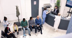https://www.vecteezy.com/photo/71392094-diverse-people-seated-in-waiting-room-preparing-for-clinical-consultations-elderly-man-and-asian-guy-engage-in-conversation-as-black-female-doctor-records-data-of-mom-and-daughter-in-hospital-lobby