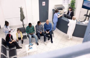 https://www.vecteezy.com/photo/71392094-diverse-people-seated-in-waiting-room-preparing-for-clinical-consultations-elderly-man-and-asian-guy-engage-in-conversation-as-black-female-doctor-records-data-of-mom-and-daughter-in-hospital-lobby