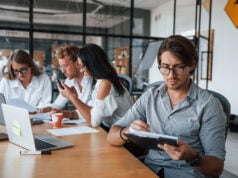 https://www.vecteezy.com/photo/15227028-guy-in-glasses-in-front-of-his-employees-young-business-people-in-formal-clothes-working-in-the-office