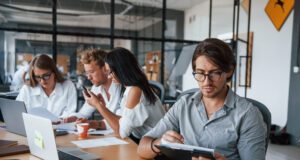 https://www.vecteezy.com/photo/15227028-guy-in-glasses-in-front-of-his-employees-young-business-people-in-formal-clothes-working-in-the-office
