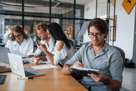 https://www.vecteezy.com/photo/15227028-guy-in-glasses-in-front-of-his-employees-young-business-people-in-formal-clothes-working-in-the-office