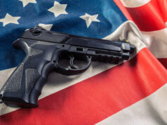 https://www.vecteezy.com/photo/51350117-handgun-lying-on-american-flag