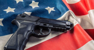 https://www.vecteezy.com/photo/51350117-handgun-lying-on-american-flag