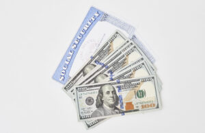 https://www.vecteezy.com/photo/31176074-social-security-card-and-us-dollars-cash-money