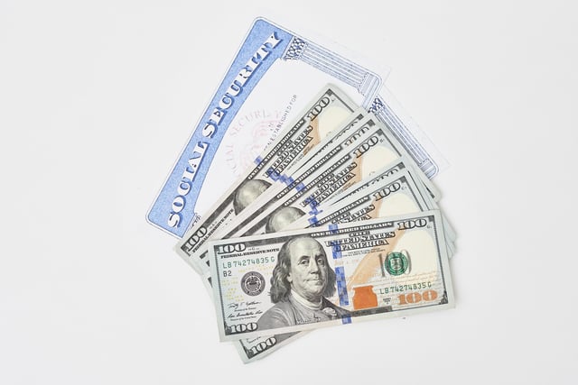Social security card and us dollars cash money https://www.vecteezy.com/photo/31176074-social-security-card-and-us-dollars-cash-money