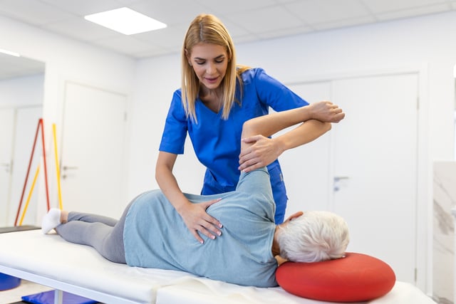 Sportsman Patient Undergoing Physical Therapy in Clinic to Recover from Surgery and Increase Mobility. Physiotherapist Works on Specific Muscle Groups or Joints to Rehabilitate from Injury. https://www.vecteezy.com/photo/42625435-sportsman-patient-undergoing-physical-therapy-in-clinic-to-recover-from-surgery-and-increase-mobility-physiotherapist-works-on-specific-muscle-groups-or-joints-to-rehabilitate-from-injury