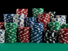 https://www.vecteezy.com/photo/72312437-vibrant-casino-poker-chips-stacked-high-on-green-felt-gambling-entertainment-concept