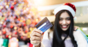 https://www.freepik.com/premium-photo/portrait-smiling-young-woman-using-mobile-phone_122657947.htm#fromView=search&page=1&position=42&uuid=090416ed-637a-4c2d-a0e5-0517cb5ad6ff&query=holiday+shopping+credit+card