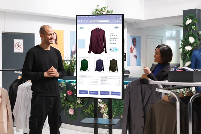 https://www.vecteezy.com/photo/35255159-male-customer-is-shown-clothing-on-an-interactive-kiosk-board-by-female-assistant-in-mall-clothing-store-asian-retail-employee-assisting-a-client-who-is-selfordering-modern-fashion-items