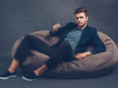 https://www.vecteezy.com/photo/13572739-stylish-and-handsome-confident-young-handsome-man-holding-his-sunglasses-and-looking-at-camera-while-sitting-on-beanbag-against-grey-background