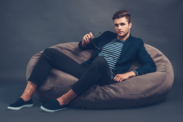 https://www.vecteezy.com/photo/13572739-stylish-and-handsome-confident-young-handsome-man-holding-his-sunglasses-and-looking-at-camera-while-sitting-on-beanbag-against-grey-background