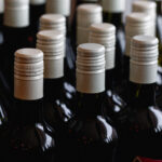 Storage of quality wine bottles with screw caps in a wine rack Close up