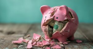 https://www.vecteezy.com/photo/70687103-broken-pink-piggy-bank-filled-with-us-dollar-bills-on-a-weathered-wooden-surface-financial-loss