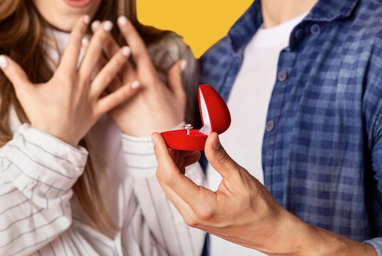 https://www.vecteezy.com/photo/52354219-marriage-proposal-and-people-emotions-focus-on-box-with-ring-in-strong-man-hand-and-excited-gestures-of-happy-and-surprised-woman-isolated-on-yellow-background-studio-shot-close-up-cropped