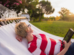 https://www.vecteezy.com/photo/11598959-woman-using-a-tablet-computer-while-relaxing-on-hammock