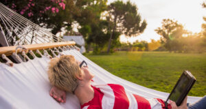 https://www.vecteezy.com/photo/11598959-woman-using-a-tablet-computer-while-relaxing-on-hammock