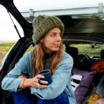 young-woman-traveling-country-side_23-2149406540