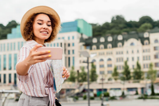 https://www.freepik.com/free-photo/woman-taking-selfie-nice-building_9510635.htm#fromView=search&page=1&position=7&uuid=1e69a570-9282-4e25-b5cd-2da5b4dfb280&query=traveler+abroad+cellphone