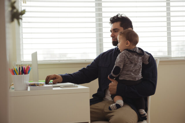 96355 https://www.freepik.com/free-photo/father-holding-his-baby-while-using-laptop-desk_11229913.htm#fromView=search&page=1&position=0&uuid=00b92839-567a-4c32-bbc1-f54f6c0e7225&query=hormone+therapydad+dressed+for+work+holding+child