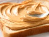 https://www.vecteezy.com/photo/74066322-a-close-up-shot-of-a-spoon-spreading-creamy-peanut-butter-onto-a-slice-of-white-bread-on-a-plate