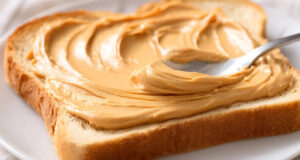 https://www.vecteezy.com/photo/74066322-a-close-up-shot-of-a-spoon-spreading-creamy-peanut-butter-onto-a-slice-of-white-bread-on-a-plate