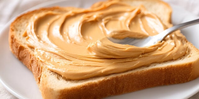https://www.vecteezy.com/photo/74066322-a-close-up-shot-of-a-spoon-spreading-creamy-peanut-butter-onto-a-slice-of-white-bread-on-a-plate