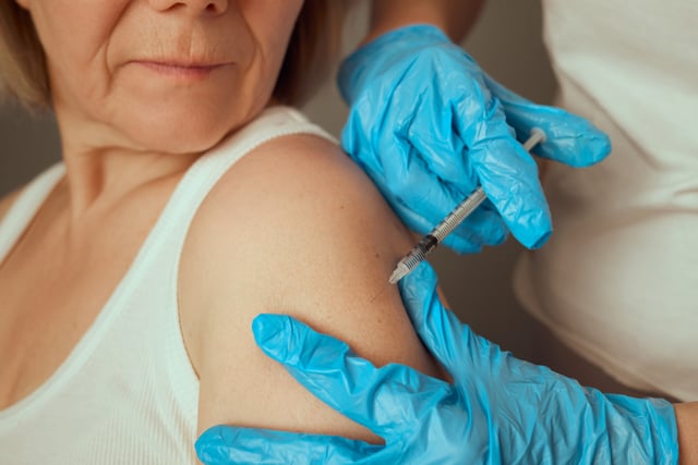 A healthcare professional administers a vaccine to an elderly woman in a clinical environment. The patient appears calm while getting the inoculation on her upper arm, ensuring health and safety https://www.vecteezy.com/photo/73420910-a-healthcare-professional-administers-a-vaccine-to-an-elderly-woman-in-a-clinical-environment-the-patient-appears-calm-while-getting-the-inoculation-on-her-upper-arm-ensuring-health-and-safety