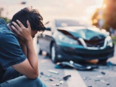 https://www.vecteezy.com/photo/43208510-a-man-sits-on-the-ground-next-to-a-car-that-has-been-in-an-accident