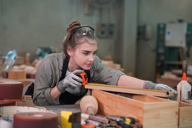 https://www.vecteezy.com/photo/53479290-a-woman-working-in-a-woodworking-shop