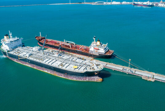 https://www.vecteezy.com/photo/7465946-aerial-top-view-of-fuel-tanker-ship-at-the-port-oil-terminal-is-industrial-facility-for-storage-of-oil-and-gas-petrochemical-products-ready-for-transport-to-further-storage-facilities